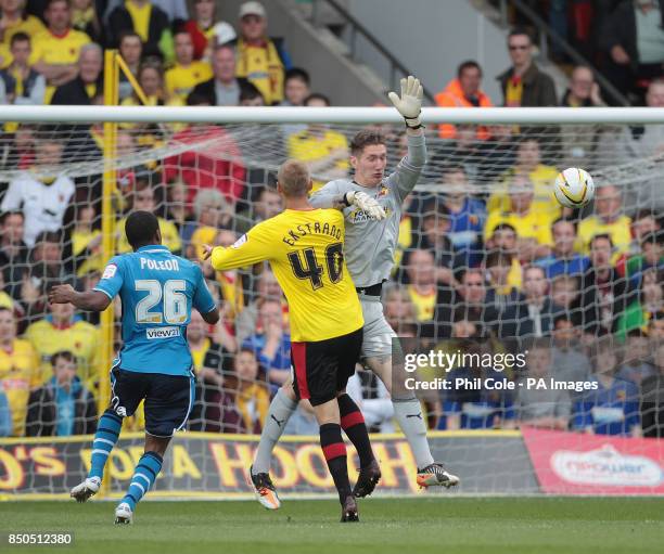 Watford's Jack Bonham gets chipped by Leeds' Dominic Poleon during the npower Football League Championship match at Vicarage Road, Watford.
