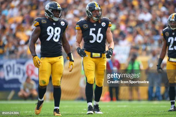 Inside linebacker Vince Williams of the Pittsburgh Steelers and outside linebacker Anthony Chickillo of the Pittsburgh Steelers react during an NFL...