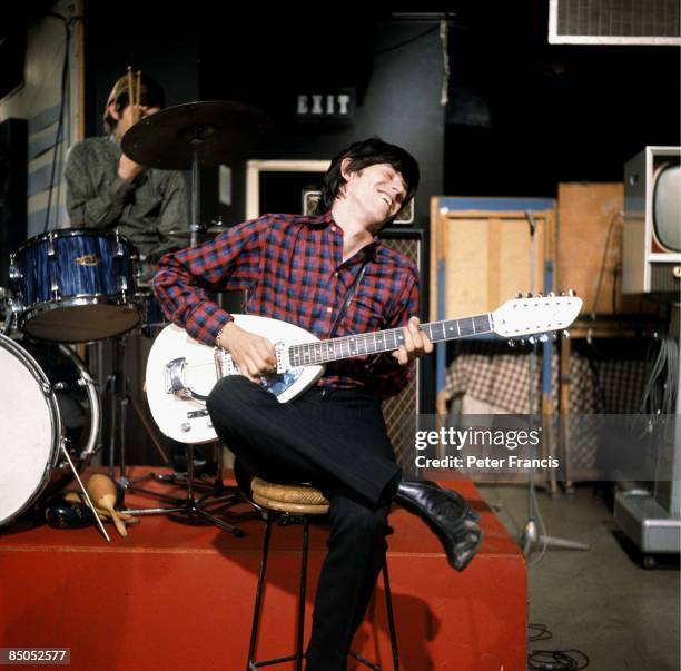 Photo of ROLLING STONES and Keith RICHARDS, of the Rolling Stones, playing Vox Mark XII twelve-string guitar on the set of Ready Steady Go! TV Show...