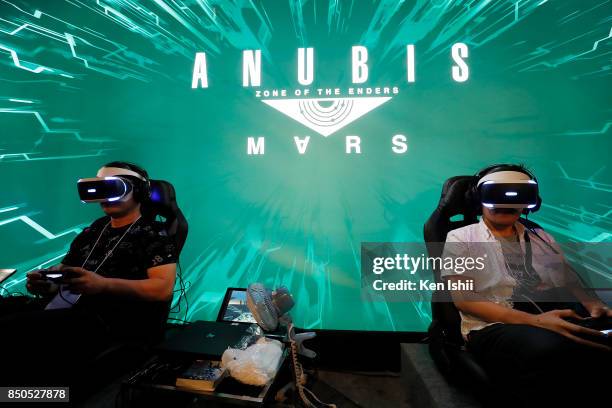 Visitors wearing VR headset play Anubis Mars video game in the Konami Holdings Corp. Booth during the Tokyo Game Show 2017 at Makuhari Messe on...