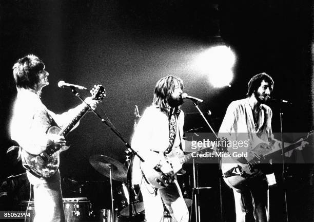 Photo of Pete TOWNSHEND and Ronnie WOOD and Ron WOOD and Eric CLAPTON, Ron Wood & Pete Townshend on stage with Eric Clapton performing live onstage...