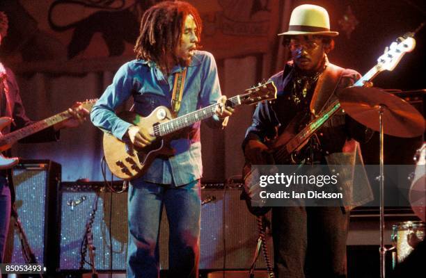 Photo of WAILERS and Aston BARRETT and Bob MARLEY, Bob Marley performing live on stage at the Odeon with Aston 'Family Man' Barrett