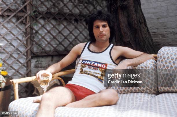 Photo of Freddie MERCURY and QUEEN; Posed portrait of Freddie Mercury, cinzano vest and shorts