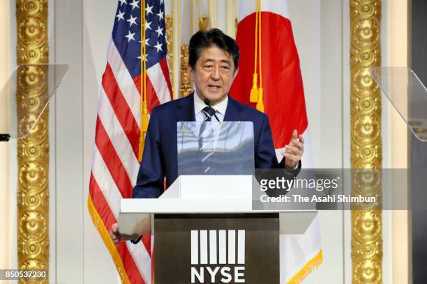 Japanese Prime Minister Shinzo Abe addresses at the New York Stock Exchange on September 20, 2017 in New York City. Abe is on 5-day tour to the...