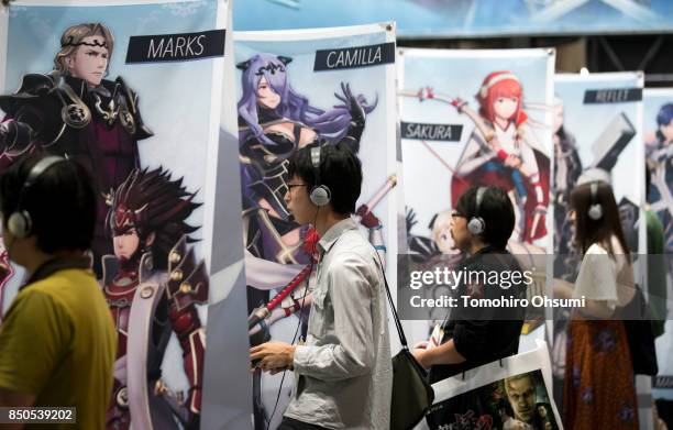 Visitors play the Warriors All-Stars video game in the Koei Tecmo Holdings Co. Booth during the Tokyo Game Show 2017 at Makuhari Messe on September...