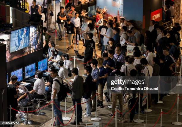 Visitors play video games during the Tokyo Game Show 2017 at Makuhari Messe on September 21, 2017 in Chiba, Japan. The annual game show, which...
