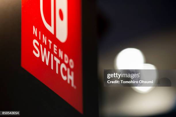 The logo of Nintendo Co.'s Switch video game console is displayed in the Capcom Co. Booth during the Tokyo Game Show 2017 at Makuhari Messe on...