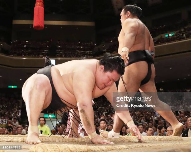 Ozeki Goeido is slapped down by fourth-ranked maegashira Shohozan on the 12th day of the 15-day Autumn Grand Sumo Tournament at Tokyo's Ryogoku...