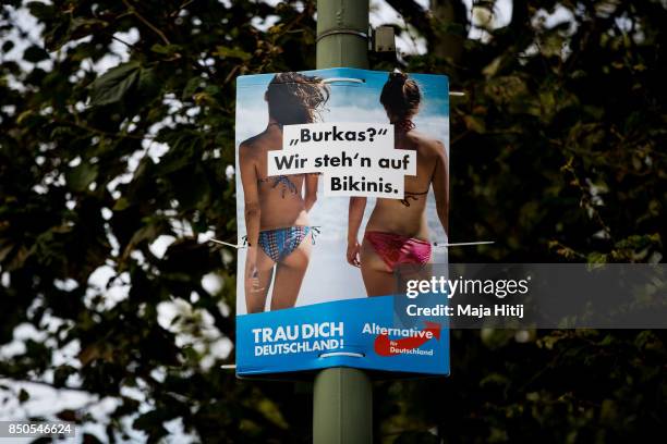 Poster from the far-right Alternative for Germany on September 21, 2017 in Berlin, Germany, that reads "Burkas? We prefer bikinis". Germany will hold...