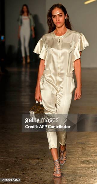 Model presents a creation for fashion house Genny during the Women's Spring/Summer 2018 fashion shows in Milan, on September 21, 2017. / AFP PHOTO /...