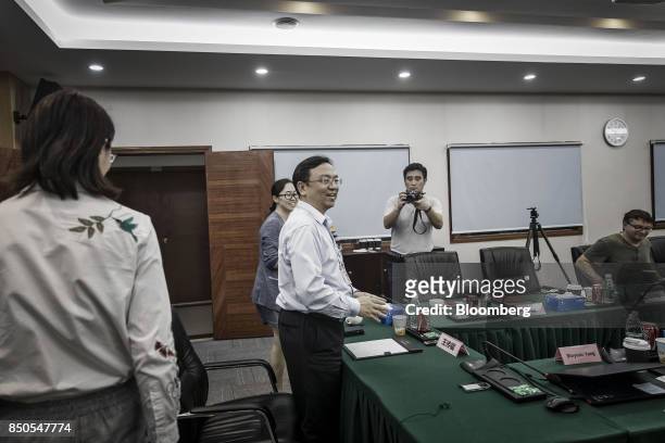 Wang Chuanfu, chairman of BYD Co., center, arrives for a news conference at the company's headquarters in Shenzhen, China, on Thursday, Sept. 21,...