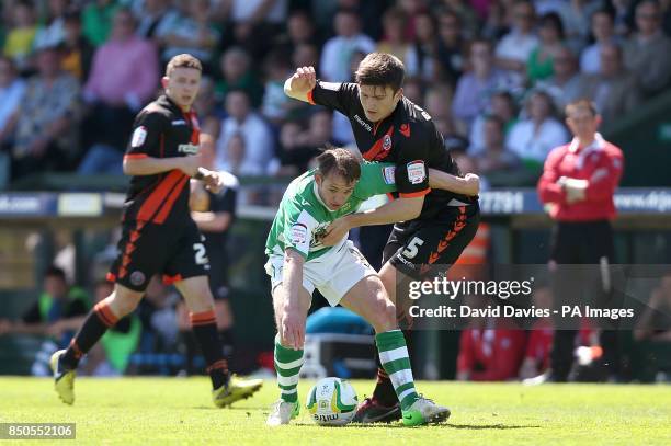Yeovil Town's James Hayter and Sheffield United's Harry Maguire battle for the ball