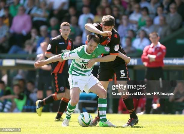 Yeovil Town's James Hayter and Sheffield United's Harry Maguire battle for the ball