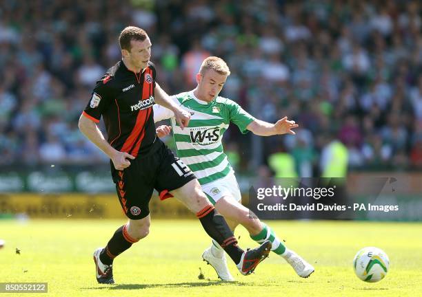 Yeovil Town's Paddy Madden and Sheffield United's Neill Collins battle for the ball