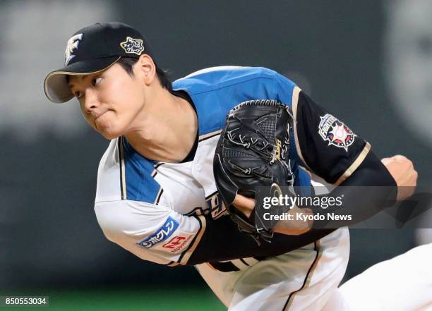 Nippon Ham Fighters starting pitcher Shohei Otani throws against the SoftBank Hawks at Sapporo Dome in Sapporo on Sept. 21, 2017. ==Kyodo