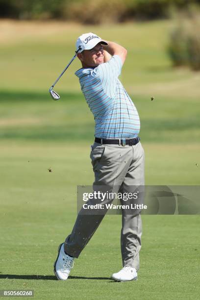 David Drysdale of Scotland plays his second shot on the 9th during day one of the 2017 Portugal Masters at Oceanico Victoria Golf Club on September...