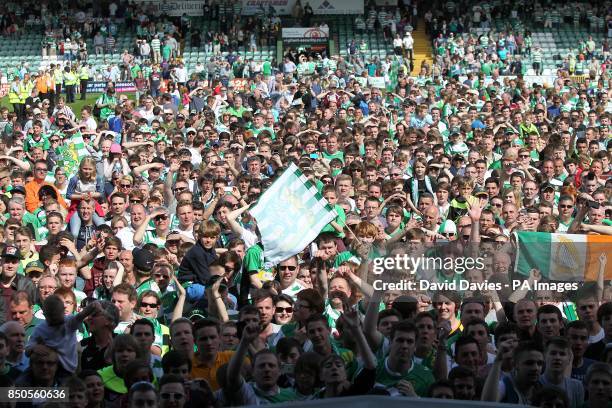 General view of a sea of Yeovil Town fans who celebrate their team's victory on the pitch, after the final whislte