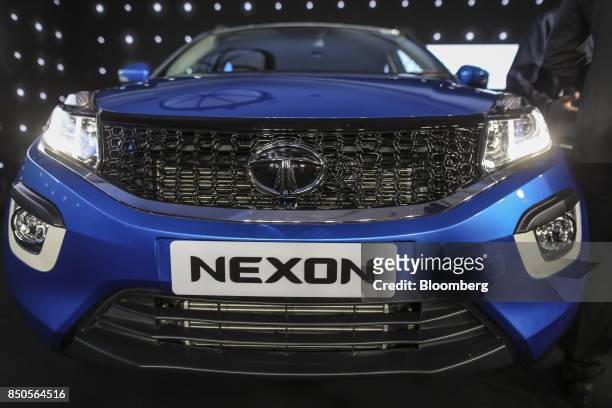 Logo sits on the front of Tata Motors Ltd.'s new Nexon sports utility vehicle during a launch event in Mumbai, India, on Thursday, Sept. 21, 2017....