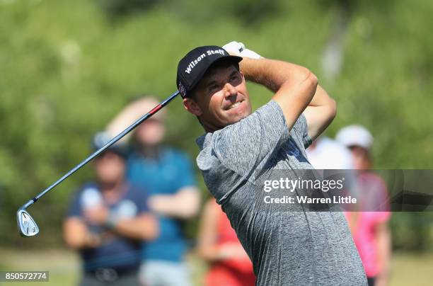 Padraig Harrington of Ireland plays his second shot on the 9th during day one of the 2017 Portugal Masters at Oceanico Victoria Golf Club on...