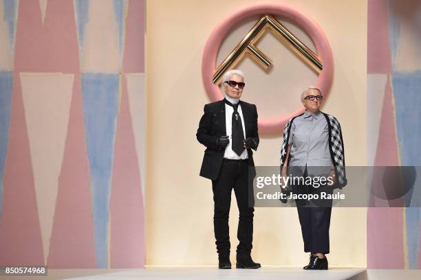 Designer Karl Lagerfeld and Silvia Venturini Fendi acknowledging the applause of the public after the Fendi show during Milan Fashion Week...