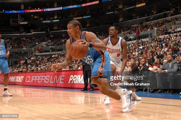 Earl Watson of the Oklahoma City Thunder moves the ball past DeAndre Jordan of the Los Angeles Clippers during the game at Staples Center on January...