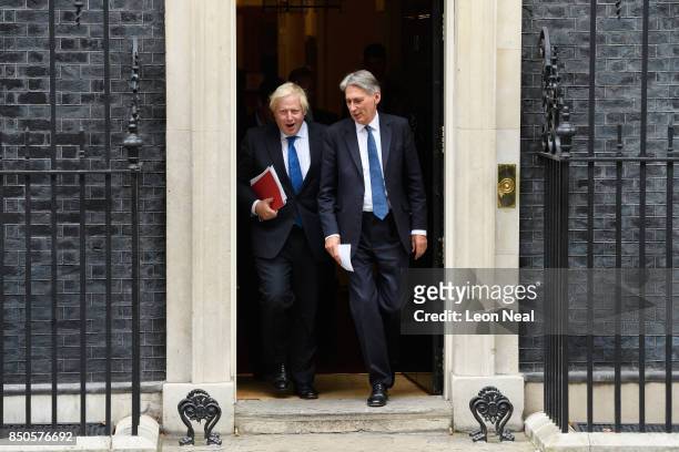 Britain's Foreign Secretary Boris Johnson and Chancellor Philip Hammond leave number 10, Downing Street following an extended Cabinet meeting on...