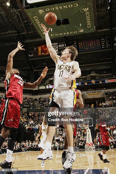 Mike Dunleavy of the Indiana Pacers lays up a shot against James Jones of the Miami Heat during the game at Conseco Fieldhouse on January 30, 2009 in...