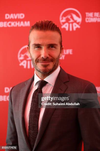 David Beckham poses for a photo during the AIA Vitality Healthy Cookout Showdown on September 21, 2017 in Singapore. David Beckham is in Singapore as...