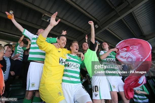 Yeovil Town players celebrate victory in the stands