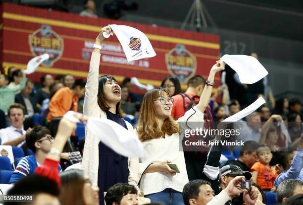 Fans cheer during the pre-season game between the the Los Angeles Kings and the Vancouver Canucks at the Mercedes-Benz Arena September 21, 2017 in...