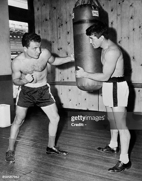 Photo taken on September 25, 1949 shows US boxer Jake LaMotta during a training session with Rocky Graziano