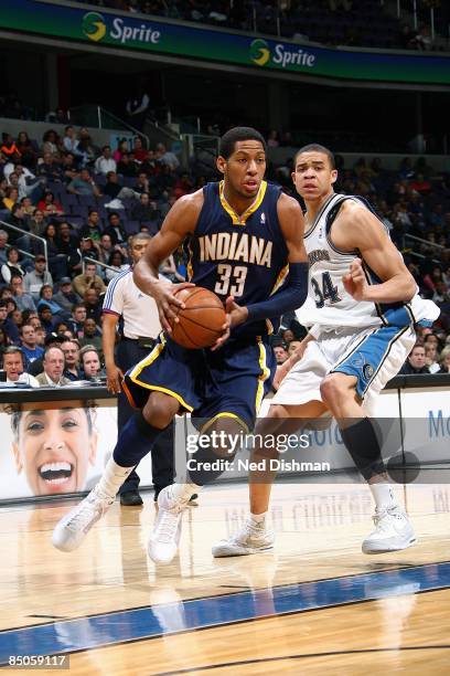 Danny Granger of the Indiana Pacers drives the ball against JaVale McGee of the Washington Wizards during the game on February 8, 2009 at the Verizon...