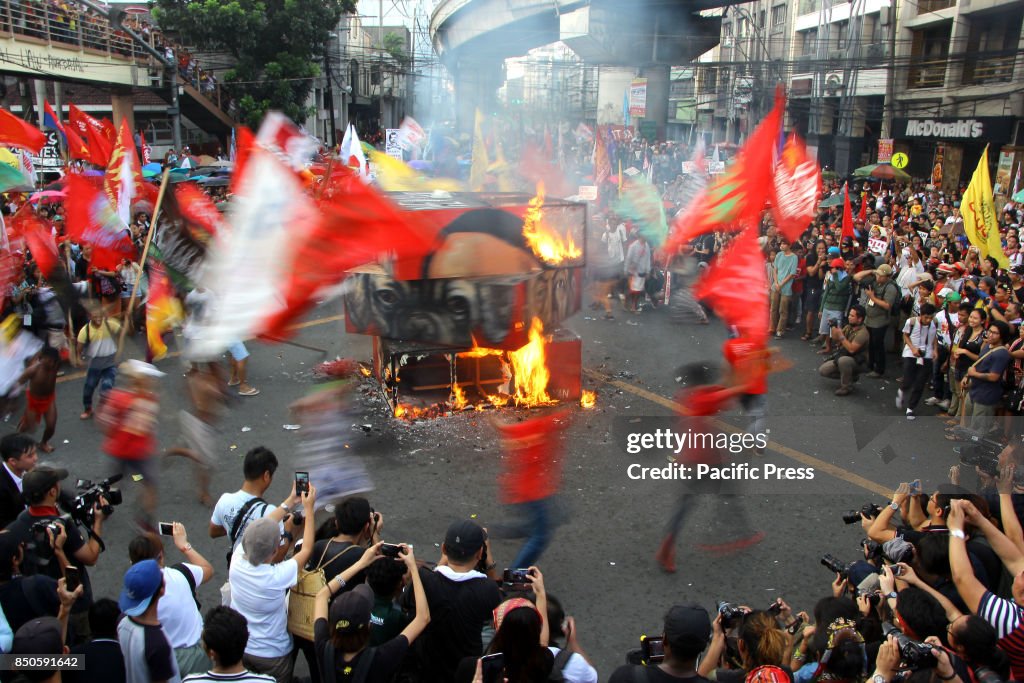 Thousands of multi-sectoral groups burned the effigy of Pres...