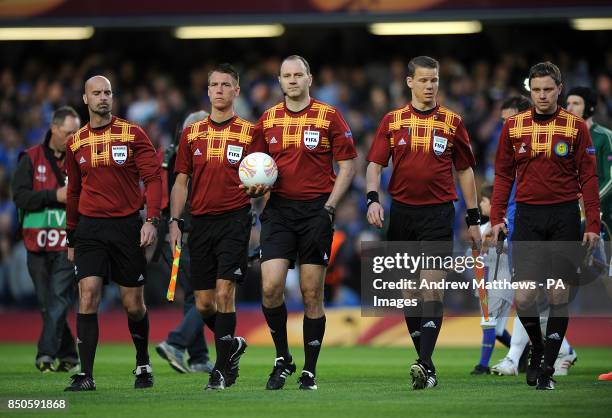 Match referee Jonas Eriksson walks out onto the pitch alongside his assistants Stefan Johannesson , Markus Strombergsson , Daniel Warnmark and...