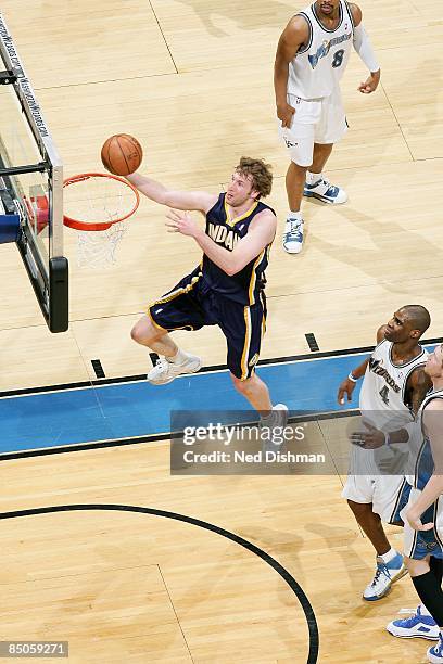 Troy Murphy of the Indiana Pacers lays up a shot past Antawn Jamison of the Washington Wizards during the game on February 8, 2009 at the Verizon...