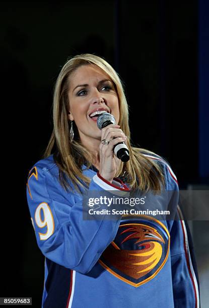 Anchor Christi Paul sings the National Anthem before the game against the Atlanta Thrashers and the Colorado Avalanche at Philips Arena on February...