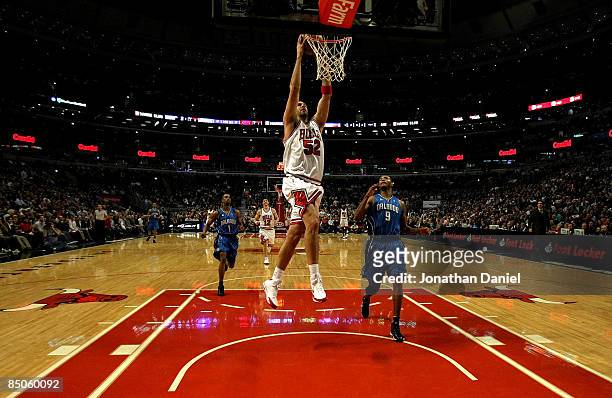 Brad Miller of the Chicago Bulls dunks against Rashard Lewis of the Orlando Magic at the United Center on Feberuary 24, 2009 in Chicago, Illinois....