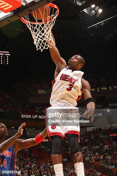 Dwyane Wade of the Miami Heat dunks against the Detroit Pistons on February 24, 2009 at the American Airlines Arena in Miami, Florida. NOTE TO USER:...