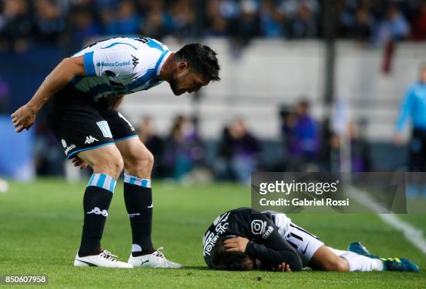 Sergio Vittor of Racing Club shouts to Angel Romero of Corinthians during a second leg match between Racing Club and Corinthians as part of round of...