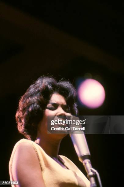 Nancy Wilson, U.S. Jazz singer, in concert, singing into a microphone, circa 1965.