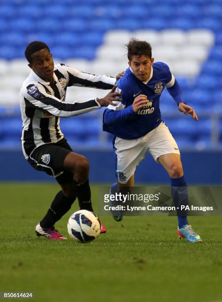 Everton's Bryan Oviedo and Newcastle's Gael Bigirimana battle for the ball during the Professional Development League One Under 21 Play Off match at...