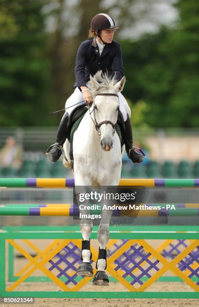 Anderida Polaris ridden by Rachel Keevil jumps a fence during the Grades B & C Handicap Jumping during day one of the Royal Windsor Horse Show at...