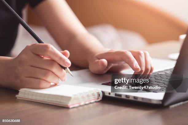 business woman working on desk - writer laptop stock pictures, royalty-free photos & images