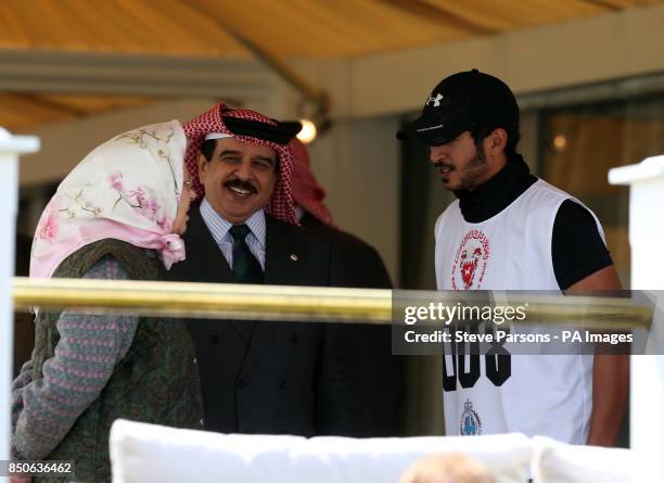 The Queen talks to the King of Bahrain Hamad bin Isa bin Salman Al Khalifa and his son Shiekh Khalid bin Hamad Al Khalifa at the finish line for the...