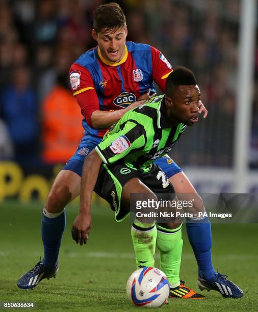 Brighton & Hove Albion's Kazenga LuaLua and Crystal Palace's Joel Ward battle for the ball