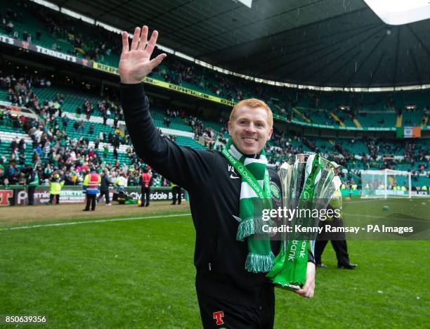 Celtic manager Neil Lennon parades the SPL trophy on the pitch after the Clydesdale Bank Premier League match at Celtic Park, Glasgow.