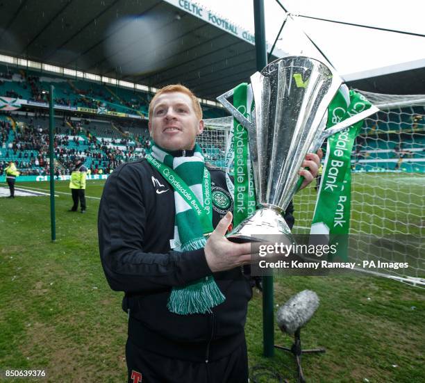 Celtic manager Neil Lennon parades the SPL trophy on the pitch after the Clydesdale Bank Premier League match at Celtic Park, Glasgow.