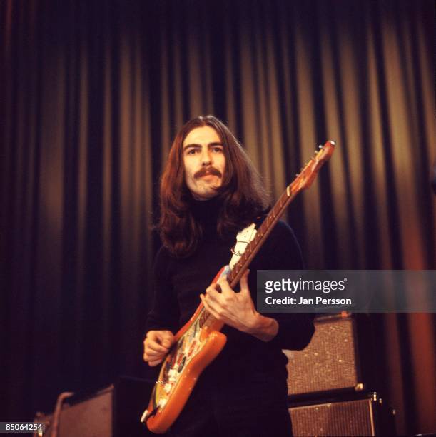 Photo of George HARRISON; performing live onstage with Delaney & Bonnie, playing 'Rocky' Fender Stratocaster guitar