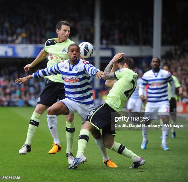 Queens Park Rangers' Loic Remy battles for the ball with Newcastle United's Michael Williamson and Mathieu Debuchy during the Barclays Premier League...