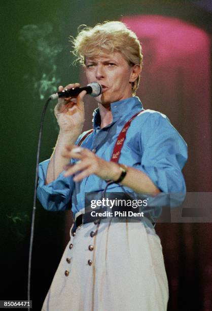 Photo of David BOWIE, performing live onstage on Serious Moonlight tour, holding cigarette